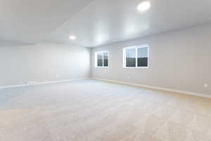 Unfurnished room featuring light colored carpet