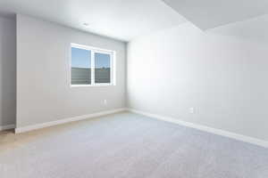 Unfurnished room featuring carpet