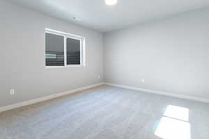 Empty room with carpet floors