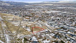 Snowy aerial view featuring a mountain view