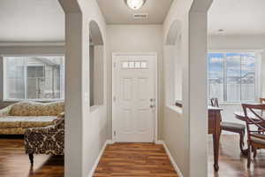 Foyer with wood-type flooring