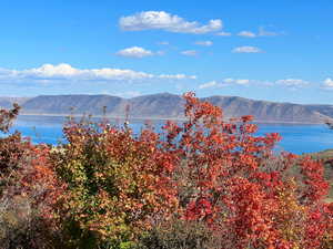 Property view of mountains with a water view