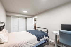 Bedroom featuring a closet and light wood-type flooring