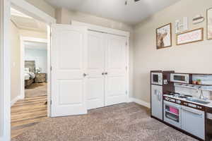 Interior space featuring carpet flooring and sink