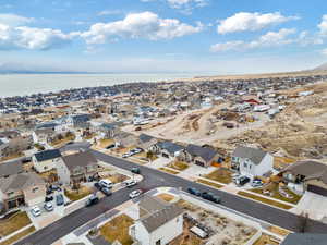 Birds eye view of property with a water view