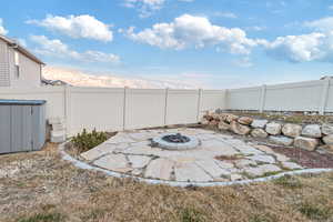 View of patio featuring a fire pit