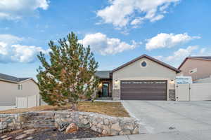 View of front facade featuring a garage