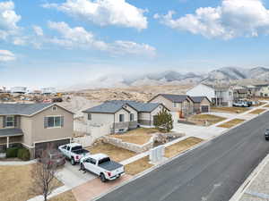 View of front of property featuring a mountain view and a garage