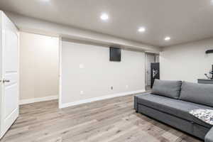 Living room with light wood-type flooring