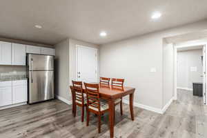 Dining area with light wood-type flooring