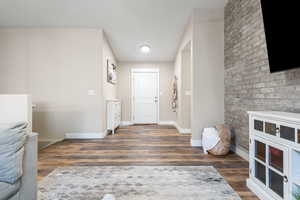 Foyer entrance with dark hardwood / wood-style flooring