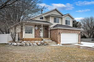 View of front of property with a garage