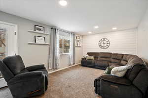 Living room with carpet floors and a wealth of natural light