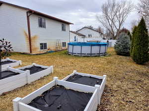 View of yard with a covered pool