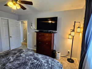 Bedroom featuring ceiling fan and carpet flooring