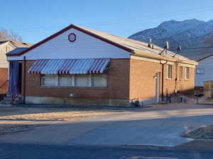 View of property exterior featuring a mountain view