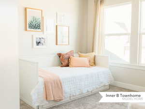 Bedroom with light carpet