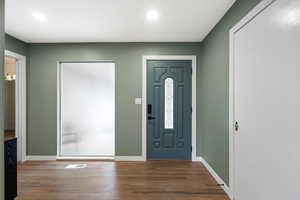 Foyer with hardwood / wood-style floors