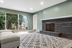 Living room featuring a fireplace and wood-type flooring