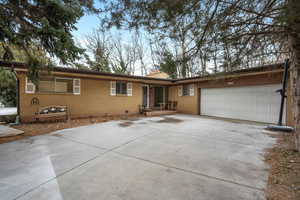 Ranch-style home featuring a garage