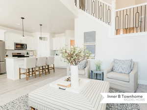 Living room with light hardwood / wood-style flooring