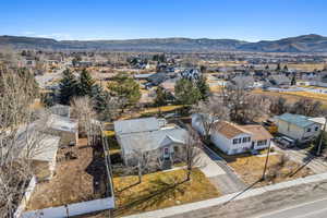 Birds eye view of property featuring a mountain view