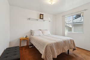 Bedroom featuring dark colored carpet