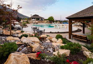 View of swimming pool featuring a mountain view, a gazebo, and a patio