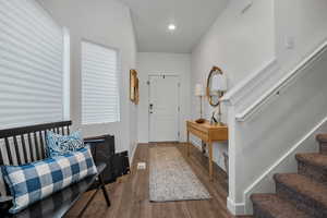 Entrance foyer featuring hardwood / wood-style floors