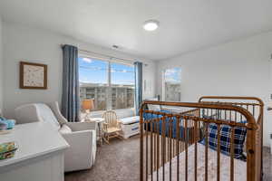 View of carpeted bedroom