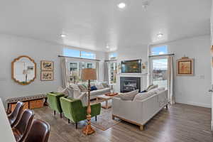 Living room with hardwood / wood-style floors and a textured ceiling