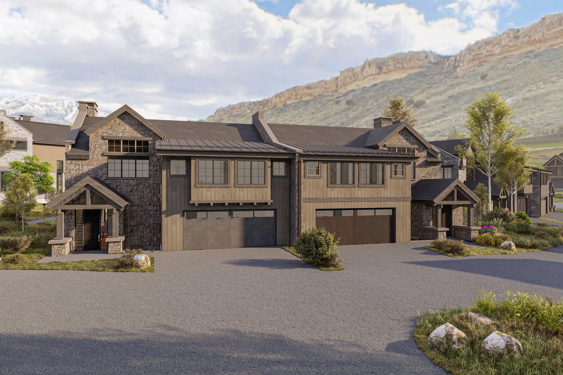 View of property with a garage and a mountain view
