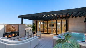 Deck featuring an outdoor living space with a fireplace