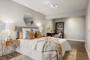 Bedroom featuring dark hardwood / wood-style floors