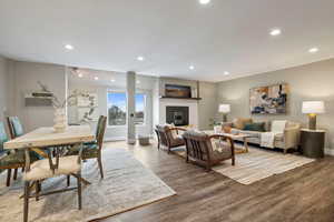 Living room featuring hardwood / wood-style flooring and a wall unit AC