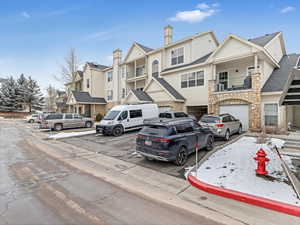 Entrance on the left side, garage is the open garage