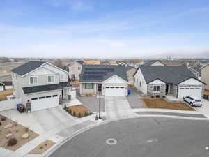 View of front of home featuring solar panels