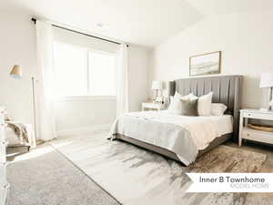 Bedroom with lofted ceiling