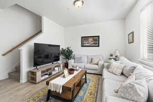 Living room with light hardwood / wood-style flooring