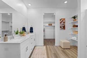 Bathroom featuring vanity and hardwood / wood-style flooring