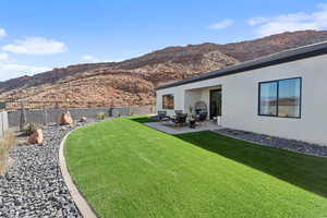 Exterior space with a mountain view and a patio area