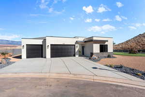 Modern home featuring a garage and a mountain view