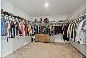 Walk in closet featuring carpet