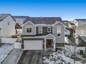 View of front of home featuring a garage