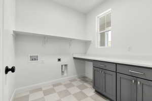 Laundry area with light floors, hookup for an electric dryer, and hookup for a washing machine