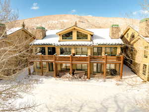 View of front of house featuring a deck with mountain view