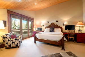 Bedroom featuring wooden ceiling, carpet flooring, vaulted ceiling, and access to outside