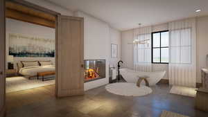 Bathroom featuring a washtub and a chandelier