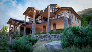 Rear view of house featuring a balcony