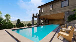 View of pool featuring a mountain view and a patio area